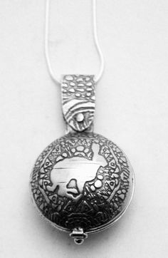 Sterling Silver hare locket  swivel design  running by annamcdade, $156.00 Silver Engraved Amulet Locket Necklace, Sterling Silver Etched Pendant Locket Necklace, Etched Sterling Silver Pendant Locket Necklace, Unique Engraved Locket Necklace Collectible, Sterling Silver Etched Locket Necklace With Round Pendant, Running Hare, Running Form, Etched Copper, Sterling Silver Locket