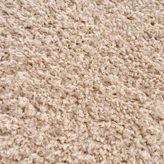 a close up view of the texture of a carpet with very soft, shaggyness