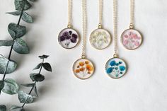 "New design of pressed baby's breath resin necklace. 14K gold plated brass chain and bezel. Pendant diameter: 0.98\"(25mm) Chain options: 14k gold plated brass chain, length: 16\"+2\" extender. 14k gold filled chain, 18 inches. Color: white, blue, purple, orange, pink. Come with handcraft gift box, beautiful gift for your loved one. Free shipping on order over 35( U.S. only)" Gold Botanical Necklace With Flower Charm, Gold Botanical Flower Pendant Jewelry, 14k Gold Filled Birth Flower Pendant Necklace, 14k Gold-filled Birth Flower Pendant Necklace, 14k Gold-filled Necklace With Birth Flower Round Pendant, 14k Gold Filled Birth Flower Necklace, 14k Gold Filled Round Pendant Necklace With Birth Flower, 14k Gold Birth Flower Pendant Necklace, Delicate Handmade Charm Necklaces For Mother's Day