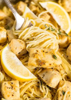 lemon chicken pasta in a skillet with a serving spoon