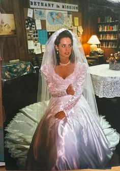 an old photo of a woman in a wedding dress