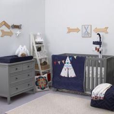 a baby's room with a crib, dresser and bed in grey tones