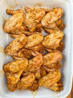 chicken wings in a baking dish ready to be cooked