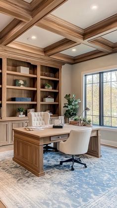 a home office with built - in bookcases, desk and chair