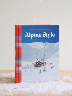 an alpine style book sitting on top of a wooden table