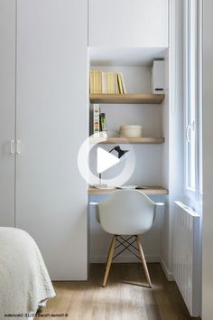 a bedroom with a bed, desk and book shelf in the corner next to it