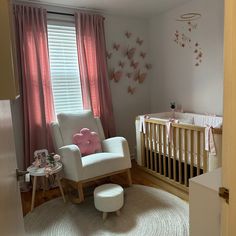 a baby's room with a rocking chair and crib