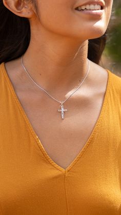 The Hawaiian Heirloom Cross Pendant features traditional Hawaiian scrollwork with maile leaves and a diamond at the center of the cross. The Hawaiian Heirloom Cross Pendant is a symbol of love, honor, and respect. Made in Hawaiʻi