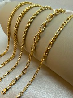 "18k Gold Rope bracelet, 7.5 inches ,3.44 gr ,3.30mm 18k Gold Figaro bracelet, 8\" inches ,1.5mm 14k Gold Franco bracelet, 7.5 inches ,4.22 gr ,3.20mm 14k Gold Curb Chain bracelet, 7.5 inches ,6.70 gr , 5mm 14k Gold Cable Chain bracelet, 7.5  inches ,4.65 gr , 5mm Please let me know if you want to customize the size . Premium lobster clasp Hook for added safety! Priced to sell! Compare our prices to other similar sellers! Arrives in a GIFT BOX and includes FREE SHIPPING within the USA and Canada. International shipping is available at the most economical rates on ETSY. I HAVE BEEN IN THE JEWELRY BUSINESS ALL MY LIFE. I am a second -generation family member making gold and jewelry. Please feel free to ask me any questions - Always happy to help! Fast Replies to messages! Superior Quality an Gold Figaro Chain Link Bracelet For Gift, Gold-plated Gold Bracelet With Curb Chain As A Gift, Adjustable Yellow Gold Bracelet With Figaro Chain, Elegant Gold-plated Cuban Link Bracelet With Adjustable Chain, 14k Gold Link Chain Bracelet, Tarnish Resistant, Real Gold Bracelet, Wrist Jewelry, Solid Gold Chains, Rolo Chain