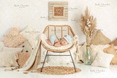 a baby is sleeping in a wicker chair surrounded by pillows and other decorative items