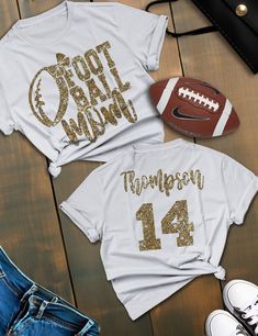 Custom Football Mom Shirt Cheer loud and proud in this dazzling custom glitter football mom shirt, perfect for game day! *This custom shirt is handmade with professional vinyl. *Our shirts are unisex and are true to size! *In the photo's you will be able to see the custom options in regards to color that you may choose from. *We use 100% cotton shirts. The glitter material does not wash off and will last through multiple washes.  *If your shirt color is out of stock we will contact you as soon as possible to see if you would like to change shirt colors. By purchasing from us you agree to the following statements: *Due to the custom nature of this item we do not accept exchanges or refunds. *We are also not responsible for lost packages. Please contact your local post office for lost packag Cute Football Mom Shirts, Game Day Team Spirit T-shirt With Glitter Print, Team Spirit T-shirt With Glitter Print For Cheerleading, Team Spirit T-shirt For Game Day With Glitter Print, Game Day Mom Outfit, Football Mom Shirts Ideas, Glitter Football Shirts, Football Shirt Designs, Football Mom Shirts