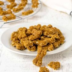 a white plate topped with granola dog treats