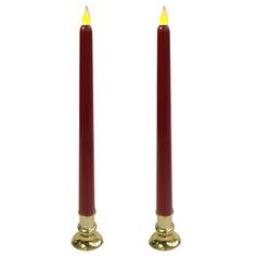 two red candles sitting next to each other