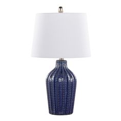 a blue ceramic lamp with a white shade on it's base and a silver finish