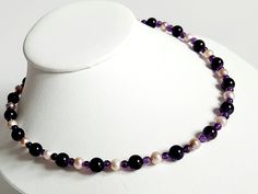 This beautiful necklace features round Amethyst beads in two sizes and 100% natural Lavender coloured Freshwater Pearls. The beads and Pearls are threaded on nylon coated 7 strand stainless steel beading wire, it's finished off with a 925 Sterling SIlver Lobster clasp and a two inch extender chain. Adjustable Faceted Bead Pearl Necklace, Single Strand Purple Beads For Gift, Purple Single Strand Beads For Gift, Purple Single Strand Beads As A Gift, Adjustable Elegant Purple Beads, Adjustable Pearl Necklace With Gemstone Beads, Adjustable Round Pearl Necklace With Gemstone Beads, Adjustable Purple Pearl Necklace With Round Beads, Adjustable Beaded Purple Pearl Necklace