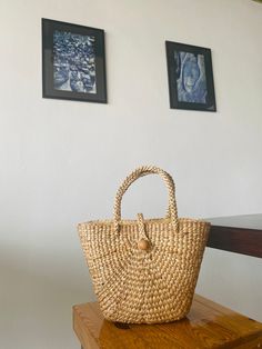 Let's support sustainability! Try our 100% handmade natural bag woven from water hyacinth. It's beautifully designed, durable, and combines style with sustainability. Crafted by skilled local artisans, our bags make a positive impact. Choose conscious fashion for a better future💚 What's special about this bag? * It preserves cultural heritage and local wisdom. * It is made by elderly individuals who want to earn some money during their free time at home. * It is 100% sustainable. * One bag prov Eco-friendly Shoulder Bag With Bamboo Handle, Natural Straw Bags With Fair Trade Details, Natural Straw Bags With Fair Trade, Natural Fiber Top Handle Bucket Bag, Natural Straw Bag For Daily Use, Fair Trade, Natural Beach Bag With Bamboo Top Handle, Eco-friendly Top Handle Natural Bucket Bag, Fair Trade Bucket Shoulder Bag For Beach, Top Handle Natural Bucket Bag For Market