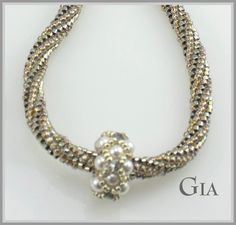 Gia is the perfect simple necklace that looks totally glamorous and can be worn on any occasion. Made with a twisted Herringbone rope and 3 - Right Angle Weave Beaded Beads. Brilliance Pearls and Crystals add the perfect touch of class.. The platinum look comes from some very beautiful silver gold iris/ palladium plated ab cylinder beads! The Kit which includes everything you need including needle and thread makes up to a 22 inch necklace. Now available in Mauve too. Mauve is shipping mid Octobe Elegant Pearl Spacer Beads, Elegant Silver Beaded Necklaces With Gold Beads, Elegant Spiral Necklaces For Jewelry Making, Elegant Beaded Spiral Jewelry, Elegant Adjustable Beaded Necklaces With Spacer Beads, Weaving Necklace, Expensive Stones, Expensive Diamond, Right Angle Weave