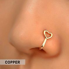 Fake Nose Piercing Nose Cuff Brass Gold Tone Heart Charm Hollow Out Size L 7/16” X W 1/4” X D 3/16” Fading / Tarnish Resistant Durable Single | Asymmetric Wearing No Piercing Required Lightweight 1 Pc / Lot Condition Nwt Mix & Match 3 Listings For $18 Queendomjewelry Btq 8k+ Sold Items 600+ Available Listings 4.9 Rating Fashion Costume Fake Faux Simulated Vegan Brand Basic Casual Golden Yellow Copper Metal Metallic Clip On Wrap Smooth Shiny Glossy Glistening Chic Gift Elegant Feminine Stylish Cl Piercing Claims, Vma Awards, Fake Nose Piercing, Heart Simple, Fake Nose Ring, Nose Cuff, Nose Piercing Hoop, Piercing Nose, Fake Nose Rings