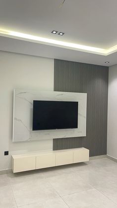 a flat screen tv mounted to the side of a wall