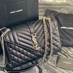 Saint Laurent Medium Monogram Quilted Leather Shoulderbag In Black And Silver Details Designer Tan Shoulder Bag, Luxury Tan Flap Shoulder Bag, High-end Black Flap Bag With Dust Bag, Designer Business Flap Bag, Luxury Tan Bags With Branded Hardware, Luxury Flap Bag With Branded Hardware, Designer Tan Flap Bag For Evening, Designer Tan Evening Bags, Designer Tan Bags For Evening