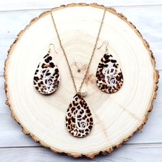 This personalized leopard print jewelry set makes a great gift for any special occasion in your life. A beautiful pebbled texture makes it very easy to complement any wardrobe choice with these. The small pearl pendant on the front of the necklace gives a subtle classy look. The embroidery threads on the back are trimmed close and neat for a professional look.  Each piece measures 2 1/2" length by 1 5/8" width in a teardrop shape. Chain length is 28 inches long with a 3 inch extension on the end. The color appeares on both sides of the earring. The hooks and chain are french style and nickle free.  The personalization on these is stitched, NOT vinyl. Please be sure to leave your choice of letter in the personalization box during purchase. If you are needing another color besides white for Trendy Brown Jewelry For Gift, Trendy Personalized Jewelry For Mother's Day, Trendy Jewelry For Mother's Day Personalized Gift, Elegant Brown Personalized Jewelry, Trendy Dangle Jewelry For Mother's Day, Personalized Teardrop Jewelry For Mother's Day, Handmade Jewelry Gift For Mom, Trendy Hypoallergenic Brown Jewelry, Trendy Brown Hypoallergenic Jewelry