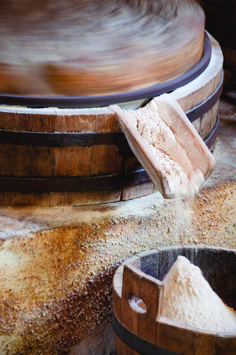 a wooden barrel with some flour in it