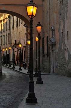 a street light sitting on the side of a road