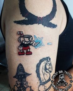 a woman with tattoos on her arm and leg, showing the different characters from cartoons