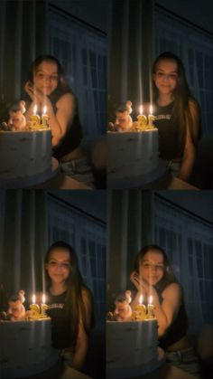 a woman sitting in front of a cake with lit candles