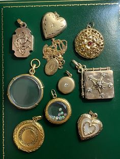 "A collection of beautiful antique and vintage lockets in solid yellow gold - ready for you to add your own photos and memories! Sold individually. 1. 14k bell-shaped locket, with ruby. Opens from the bottom. Engine-turned interior, florentine details on exterior. 6.78g, 1\"X 1\". 2. 14k heart locket, with etched decoration and star-set diamond. Matte finish. 3.95g, 1\" x 0.75\". 3. 14k heart locket with mother of pearl inlay, ca. 1930. 3.53g, 1\" x 0.75\". [SOLD OUT] 4. 18k antique Victorian ci Affordable Traditional Locket Jewelry, Luxury Traditional Locket Jewelry, Luxury Vintage Heirloom Jewelry, Cheap Sentimental Locket Jewelry, Luxury Vintage Pins As Gifts, Luxury Heirloom Jewelry Hallmarked, Luxury Antique Jewelry For Memorial, Luxury Antique Jewelry For Vintage Events, Traditional Luxury Locket Jewelry