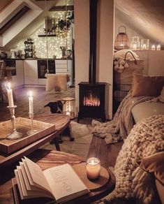 a living room filled with furniture and a fire place next to a fireplace in a loft