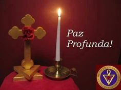 a candle is lit in front of a red background with the words, paz profunda