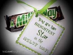 two candy bars tied to a green ribbon with the words you are the brightest star in the galaxy