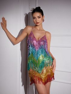 Discover the ultimate way to stand out with our Indy V Neck Rainbow Crystal Fringe Mini Dress. Featuring a unique v neck design and dazzling rainbow crystal fringe, this mini dress will make you the center of attention. Perfect for parties and special occasions, this dress will have you feeling confident and stylish. Material: 100% Polyester Stretch Factor:?Non?Stretch Clean: Dry clean only Color may vary due to the lighting on images Model is wearing an S Rainbow Fringe Dress, Rainbow Fringe, Crystal Fringe, V Neck Design, 30th Party, Fringe Mini Dress, Chain Dress, Bandage Midi Dress, Mesh Maxi Dress