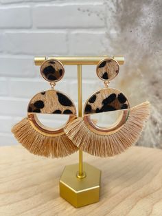 These Safari Earrings will take you on a wild fashion adventure! Featuring a playful leopard print with fringed and gold detailed accents, these earrings promise to bring fierce style to any outfit. So take a walk on the wild side and accessorize your wardrobe with these one-of-a-kind earrings! Trendy Fringe Earrings, Trendy Leopard Print Dangle Earrings, Wild Fashion, Leopard Earrings, Walk On The Wild Side, Adventure Style, Inspo Board, Take A Walk, Hollywood Glam