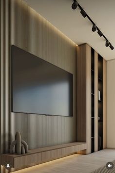 a large flat screen tv mounted to the side of a wall