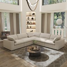 a living room filled with lots of furniture in it's centerpiece and large windows