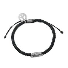 From Thailand's Napapat comes this cord bracelet in an onyx hue. The work of Karen hill tribe artisans the bracelet is expertly braided by hand. It features a cylindrical hand-stamped silver accent with a flower motif and a silver peace symbol charm which both contrast nicely against the dark tone of the bracelet. A sliding knot closure allows for an individualized fit. Adjustable Artisan Sterling Silver Beaded Bracelets, Everyday Silver Braided Bracelet With Sliding Knot, Adjustable Braided Bracelet Jewelry, Adjustable Braided Jewelry Bracelet, Nickel-free Silver Braided Bracelet For Friendship, Silver Sterling Braided Bracelet With Sliding Knot, Spiritual Braided Bracelet Jewelry, Sterling Silver Braided Bracelet With Sliding Knot, Black Sterling Silver Bracelets For Friendship