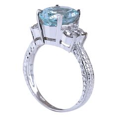 Stamped: 14K White Gold Total Ring Weight: 4.5 Grams Ring Length: N/ARing Width: N/A Gemstone Weight: Total Natural Aquamarine Weight is 3.33 Carat (Measures: 11.10x8.95 mm) Color: Blue Diamond Weight: Total Natural Diamond Weight is 0.70 Carat Quantity: 4 Color: F-G, Clarity: VS2-SI1 Face Measures: 11.10x13.70 mm Sku: [702101W] Luxury 14k White Gold Topaz Ring With Center Stone, Luxury Three Stone Gemstones For Anniversary, Elegant Three Stone Birthstone Ring For Formal Occasions, Elegant Silver Three-stone Gemstones, Elegant Three Stone Silver Gemstones, Elegant Blue Topaz Gemstone With Center Stone, White Gold Three Stone Blue Topaz Ring, Luxury Round Topaz Ring With Center Stone, Luxury Blue Topaz Promise Ring