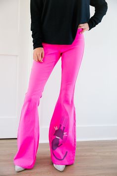 Introducing the SCAREDY CAT PINK FLARES - the perfect pants for the fashionably playful! These hot pink flares feature a uniquely cool scared cat design. Add some whimsy to your wardrobe and strut your stuff in these eye-catching pants. All orders are currently shipping within 14 business days. To receive item quicker, expedited shipping is available at checkout. **ALL HALLOWEEN ORDERS MUST BE PLACED WITH EXPEDITED SHIPPING TO GUARANTEE DELIVERY BY OCT. 31 IF PLACED AFTER OCT. 15** Pink Wide Leg Flares For Spring, Trendy Fitted Pink Flares, Spring Stretch Pink Flares, Pink Fitted Wide Leg Flares, Casual Pink Flare Pants, Trendy Pink Flare Bottoms, Scaredy Cat, Scared Cat, Perfect Pant