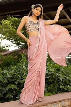 Mauve pink pre-draped saree with scattered effect work using shaped sequin and beads around the hemline. Paired with a fully embellished holographic sequin blouse with spaghetti straps. - Aza Fashions Pink Party Wear Pre-draped Saree With Mirror Work, Pink Party Wear Pre-draped Saree With Sequins, Pink Sequined Pre-draped Saree For Party, Pink Pre-draped Saree With Mirror Work For Party, Semi-stitched Pink Sequin Pre-draped Saree, Pink Sequined Saree For Party Wear, Pink Pre-draped Party Wear Saree With Mirror Work, Pink Sequin Party Wear Saree, Pink Sequined Pre-draped Saree For Reception