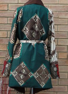 A unique three African print jacket. This stylish jacket is loose fitting, fully lined to keep you warm and very comfortable  Jacket has no closure( Belt included), big raglan long sleeves and waterfall collar. Available in 5 sizes  SMALL- (8-10) uk sizes  MEDIUM- (12-14)  LARGE (16-18)   X-LARGE (20-22)   XX-LARGE (24-26)   Can be made in other prints please enquire to see what prints we have in stock. Winter Outerwear With Patchwork And Kimono Sleeves, Bohemian Printed Winter Outerwear, Printed Long Sleeve Outerwear For Fall, Bohemian Long Sleeve Brown Kimono, Bohemian Long Sleeve Printed Cardigan, Bohemian Brown Long Sleeve Kimono, Multicolor Geometric Pattern Long Sleeve Outerwear, Vintage Long Sleeve Patchwork Kimono, Vintage Long Sleeve Kimono With Patchwork