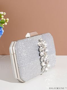 BagForLove - Deluxe Wedding Clutch with Diamond-styled Decoration - Versatile and Elegant Evening Bag Product Description Color Silver Details Rhinestone Magnetic No Strap Type Chain Bag Size Mini Style Glamorous Pattern Type Plain Type Square Bag Closure Type Kiss Lock Material Glitter Composition 100% Polyester Care Instructions Do not wash Size Chart INCH CM Bag Height Bag Length Bag Width Strap Length 4.7 inch 7.9 inch 2.2 inch 47.2 inch Bag Height Bag Length Bag Width Strap Length 12 cm 20 cm 5.5 cm 120 cm Details Pictures Similar Products h2 { text-align: center; } /* æ¢è¡ */ li{ white-space: normal; word-break: break-all; word-wrap: break-word; } .red-box { width: 100%; display: flex; flex-direction: row; flex-wrap: wrap; justify-content: center; } .red-box > div { width: 190px; h Rectangular Wedding Bags With Rhinestones, Silver Rhinestone Shoulder Bag For Wedding, Silver Bags With Rhinestones For Wedding Guest, Rectangular Rhinestone Shoulder Bag For Weddings, Silver Rectangular Wedding Bag, Silver Clutch Bag For Wedding Guest, Silver Rectangular Shoulder Bag For Wedding, Silver Handheld Shoulder Bag For Wedding, Silver Clutch Shoulder Bag For Wedding