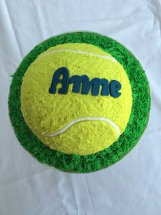 a tennis ball cake with the word ame on it