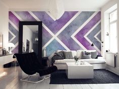 the living room is decorated in white and purple tones with black accents on the walls