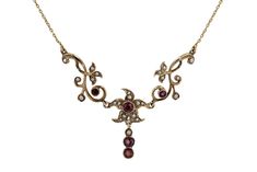 This exquisite Art Nouveau necklace features an openwork design with intricately crafted, purple and seed pearls cascading down. Centered upon a flower or a starfish, you'll love the decorative, naturalistic floral design of this 14 karat yellow gold treasure over 100 years old. Each gemstone was sustainably sourced, giving this antique piece a timeless radiance and soft, glowing patina. Photography © Bella Rosa Galleries Santa Barbara, CA Condition: Very Good Era: Art Nouveau Year: 1895-1915 Me Gold Treasure, Art Nouveau Necklaces, Stella Marina, Fairy Jewelry, Heart Necklace Diamond, Diamond Cocktail Rings, Seed Pearl, Jewelry Creation, Diamond Heart