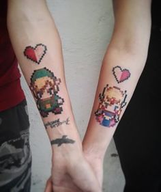 two people holding hands with tattoos on their arms, both have heart shaped pixeles