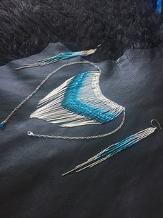 "Maui Swan Designs beautiful, glamorous and long Glass Beadwork gemstone necklace with 1mm solid sterling silver chain fringe. Indigenous inspired glass seed bead original design using size #15 glass seed beads hand sewn beautifully together with solid sterling silver chain, silver lined glass seed beads & nylon thread coated in Maui beeswax to maintain strength. Wire wrapped on solid sterling silver chain with apatite & aquamarine gemstones. Necklace is interchangeable sizes from 15\"-2 Silver Party Jewelry With Beaded Fringe, Artisan Jewelry With Beaded Fringe, Elegant Blue Fringe Jewelry, Silver Beaded Fringe Dangle Jewelry, Artisan Jewelry With Beaded Fringe For Gift, Unique Beaded Fringe Jewelry As Gift, Unique Beaded Fringe Jewelry For Gift, Sterling Silver Beaded Multi-strand Jewelry, Elegant Silver Dangling Beads