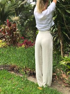 "LINEN HIGH WAISTED STRAIGHT LEG TROUSERS - CUSTOM ITEM** High waisted vintage style trousers. Tailored at the waist, pleated at the front, two pockets at the hips, and darts at the back of the waist for a defined fit. Pocket opening button and press stud closure. Wide/straight leg finishing below the ankle. Tailored to your height FARGELAND is an independent, female-owned business. All of my clothing is designed and handmade by me in my art studio in Bulli, Australia. Just south of Sydney. When Versatile Full Length Beige Bottoms, Versatile Full-length Beige Pants, High Waist Stretch Linen Pants, High-waist Stretch Linen Pants, Relaxed Straight Leg Bottoms In Neutral Color, Relaxed Full-length Bottoms For Spring, Relaxed Full Length Bottoms For Spring, Versatile Bottoms In Neutral Color With Relaxed Fit, White Linen Full-length Bottoms