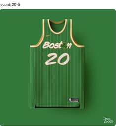 a green jersey with the number 20 on it is hanging up against a green background